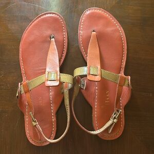 Cole Haan T strap sandal. Leather and patent leather.